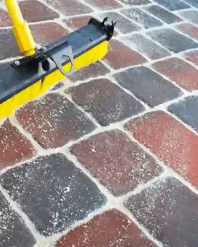Filling in pavers with sand